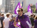 Volter with megaphone in crowd
